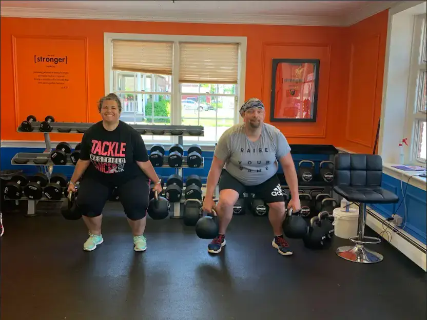 Two members lifting kettlebells together in the Westfield studio